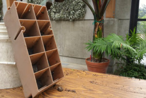 The planters for the living wall rest on a table.
