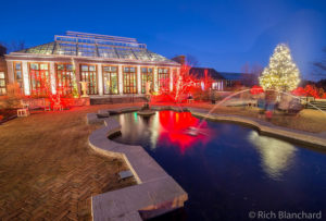 The Winter Garden during night lights lit up with red and white lights.