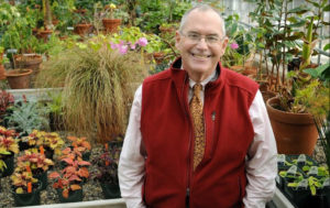 John Trexler stands for a photo in the Garden's greenhouse.