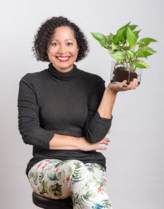 Curbelo, Perla Sofia posing for a photo with a plant.