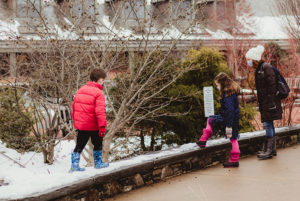 A family walking through the Winter Garden.