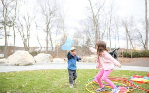 Two children play with butterfly nets in The Ramble during the sensory friendly evening.