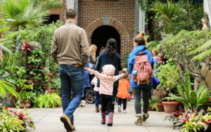 A family walks through the Orangerie