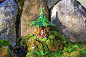 Hosta Leaf fairy house surrounded by moss and rocks