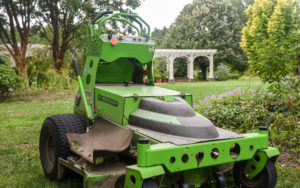 Green tractor sits on top of the Lawn Garden