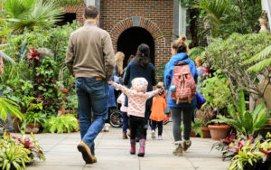 A family walks through the Orangerie