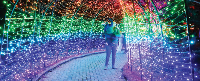 Mother and child explore the rainbow tunnel.