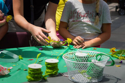 Children create crafts and use their imagination.