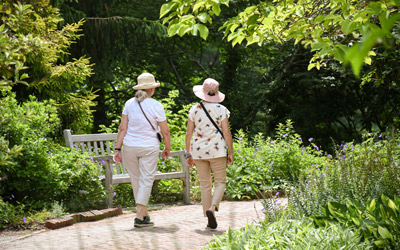 Two visitors walk along the paths of the Lawn Garden.