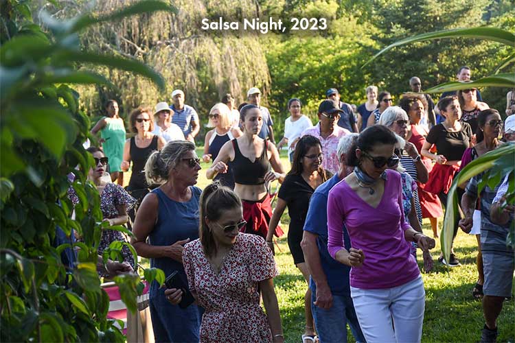 Many visitors dance in the Lawn Garden during Salsa Night.