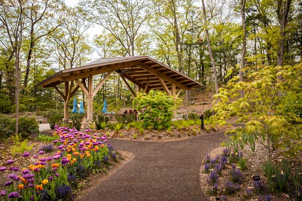 The Ramble Pavilion surrounded by spring blooms.