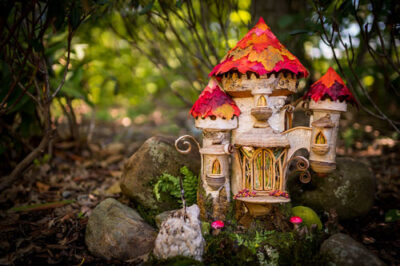 A fairy house displayed on the ground during Enchanted Forest