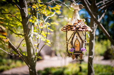 A fairy house hangs from a tree during the Enchanted Forest exhibit.