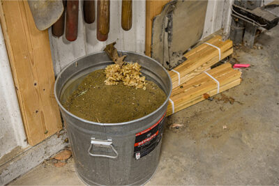 A bucket of sand and oil helps to get rid of surface dirt and rust after everyday use