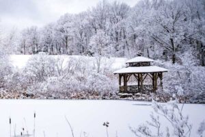 The Wildlife Refuge Pond covered in snow during the wintertime