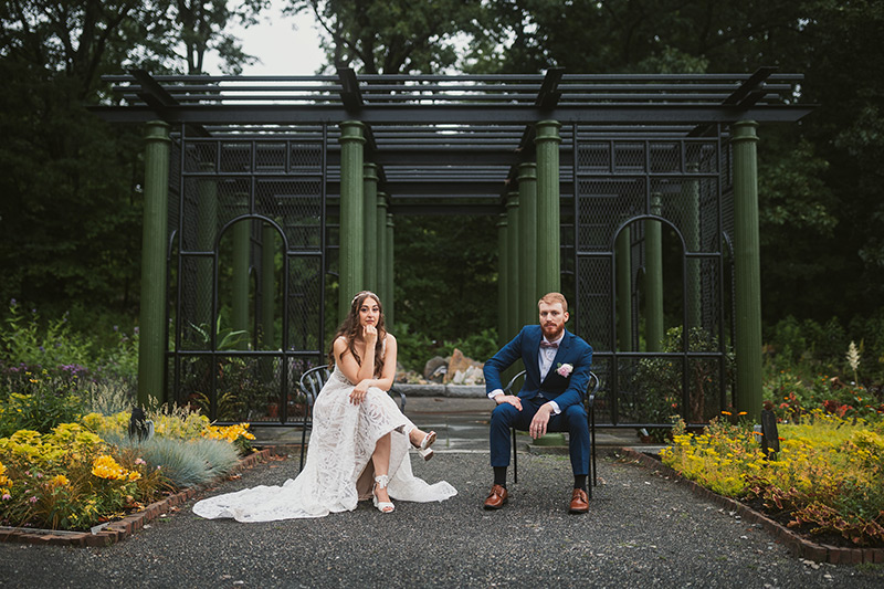 Bride and groom sitting in the Garden of Inspiration