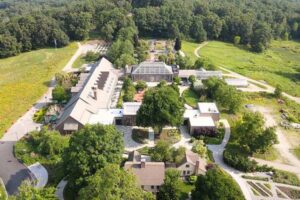 An aerial shot of New England Botanic Garden at Tower Hill in 2023. Historical TImeline features image