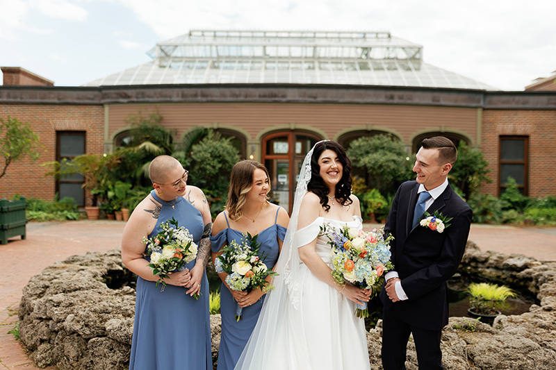 Bride and groom photo with bridemaids in the Winter Garden