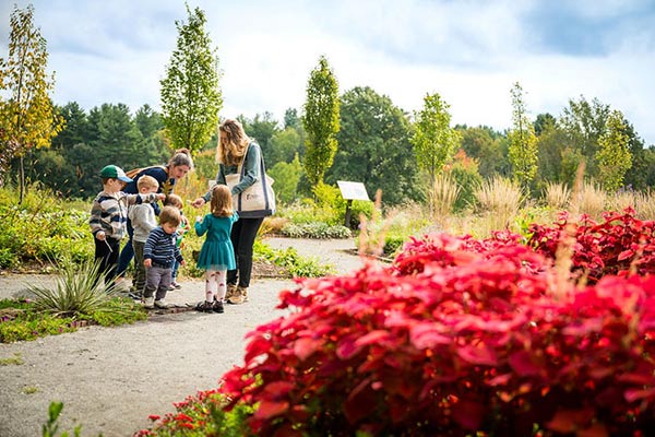 Youth education instructor and students outdoors