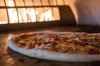 Pizza in a fire burning oven
