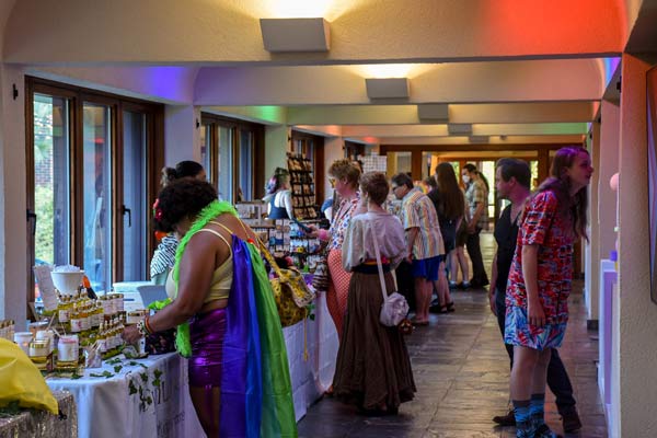 vendors and visitors at the pride celebration in the Milton gallery