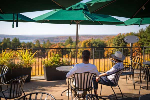 Visitors on the terrance, observing the Wachusett Reservior and fall foliage