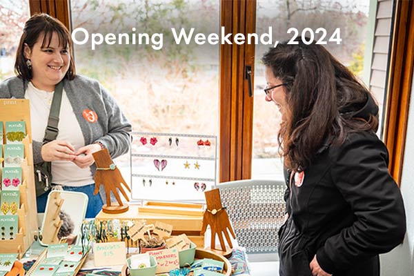 A vendor selling selling jewelry to a customer