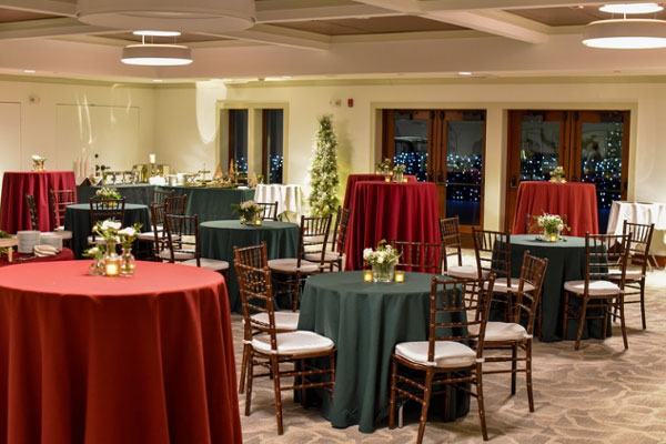 Holiday table set up with holiday trees and decor in the reservoir room