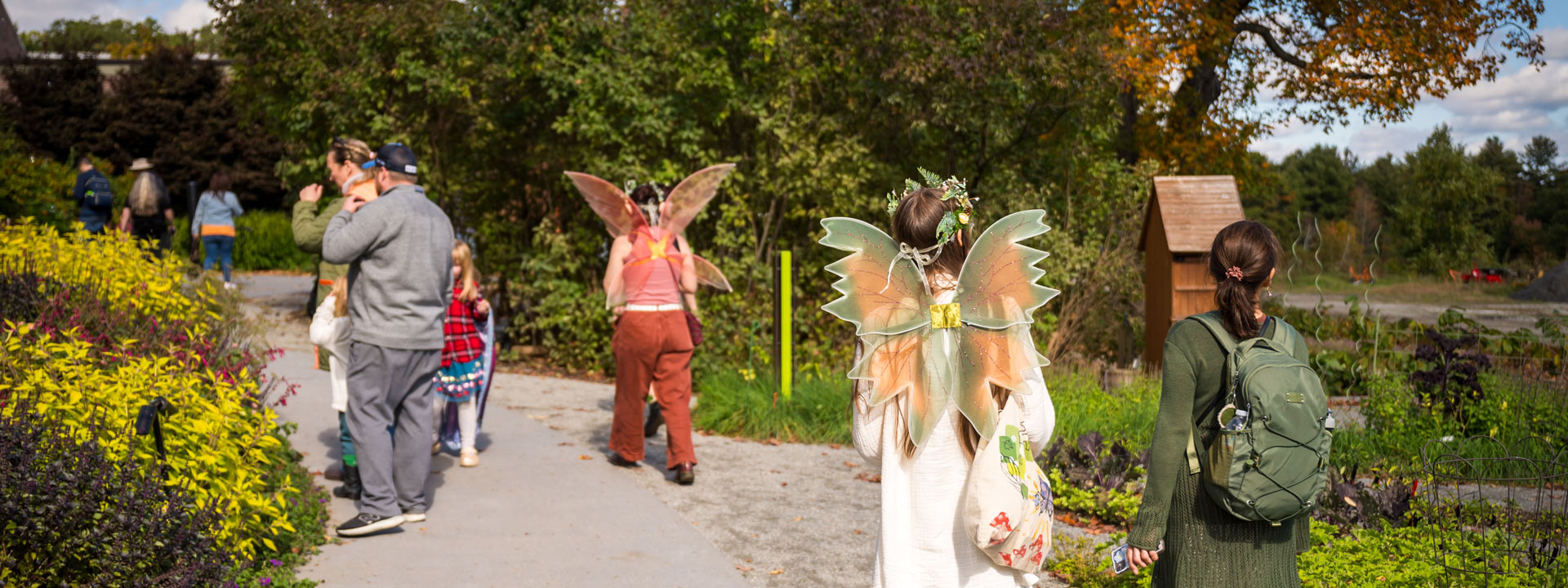 Visitors dressed as fairies walking near the Cottage Garden