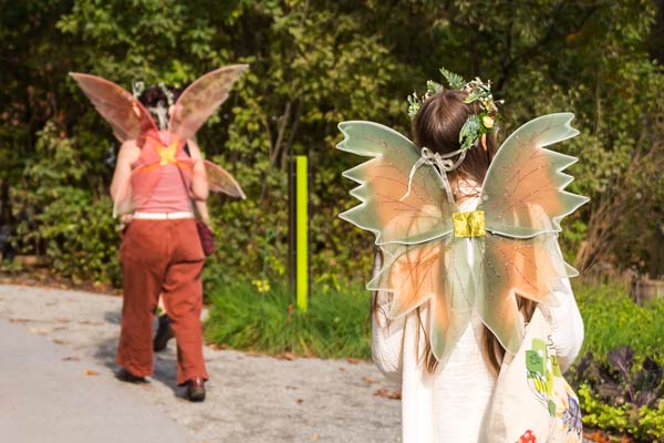 Visitors dressed as fairies walking near the Cottage Garden