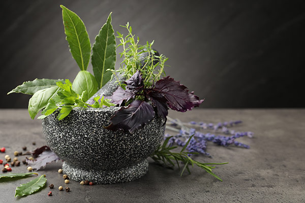 Aromatic herb in a mortar pestle